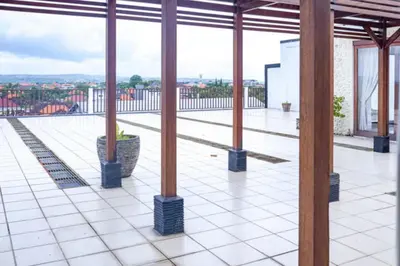 a view from the roof of a building with columns at KoolKost at Bypass Jimbaran - Minimum Stay 30 Nights in Kuta