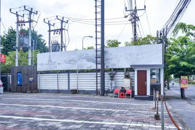 a building on the side of a street at KoolKost at Bypass Jimbaran - Minimum Stay 30 Nights in Kuta