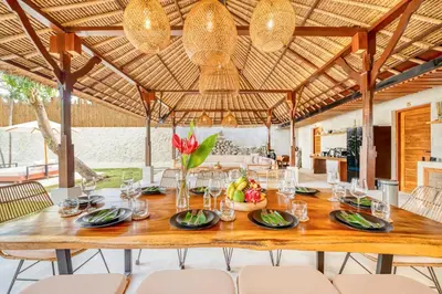 a wooden table in the middle of a dining room with chairs at Villa Toscana - 7 BDR Luxury Villa with private pool in Seminyak
