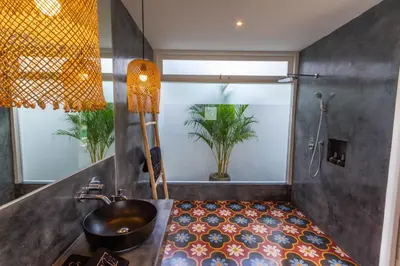 a bathroom with a sink and a shower at Villa M2 Seminyak by Alfred in Bali in Seminyak