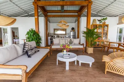 a living room with a couch and a table at Villa M2 Seminyak by Alfred in Bali in Seminyak