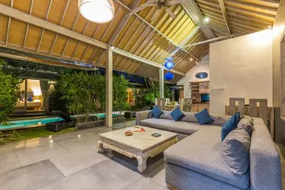 a living room with a couch and a coffee table at VILLA Nuri Merah 2 in Seminyak