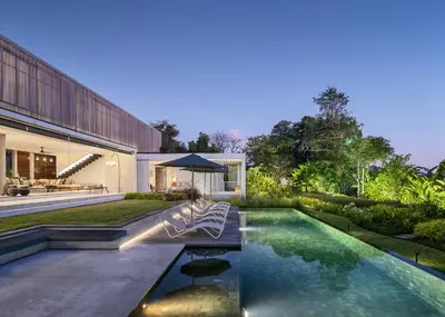 a swimming pool in the backyard of a house at La Maison d'Ulysse - Luxury 4-Bedroom Villa with Pool in Canggu in Kerobokan
