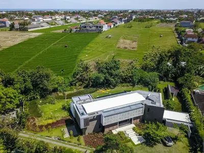 an aerial view of a building in a field at La Maison d'Ulysse - Luxury 4-Bedroom Villa with Pool in Canggu in Kerobokan