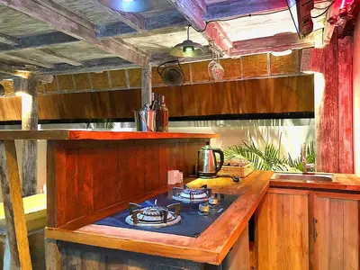 a kitchen with a wooden island with a stove at PROMO Private Vacation Rental Villa 2 Pools 4 Bedrooms 4 Bathrooms Free Scooter up to 3 scooters in Seminyak