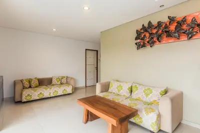 a living room with a couch and a table at Mi Casa Residence in Seminyak