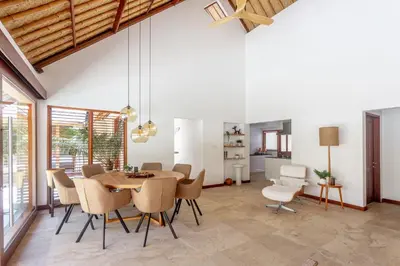 a dining room with a table and chairs at Balidroomvilla Sanur - Full Serviced - Beachside in Sanur