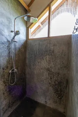 a shower in a bathroom with a window at Villa Palm Jari 1 by Alfred in Bali in Canggu