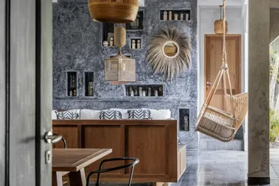 a dining room with a table and chairs at Villa Palm Jari 1 by Alfred in Bali in Canggu