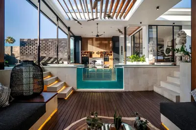 a lobby of a building with a swimming pool at Villa Australis in Kerobokan