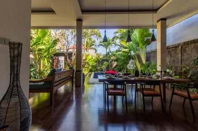 a dining room with a table and chairs at CASA PINARAK 1 I 3BR Private Villa near Seminyak in Seminyak