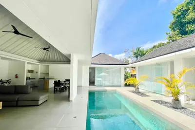 an open living room and swimming pool in a house at Alami Luxury Villa in Seminyak