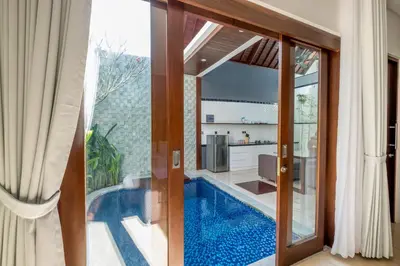 a villa with a swimming pool in a house at PANDAWA VILLAS SEMINYAK in Seminyak