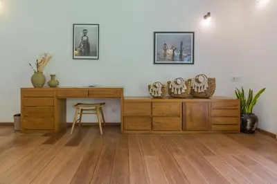 a room with a wooden desk and a table at Villa B in Seminyak