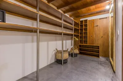 a room with shelves and a wooden ceiling at Villa B in Seminyak
