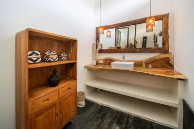 a bathroom with a sink and a mirror at Villa Hatari Canggu in Kerobokan