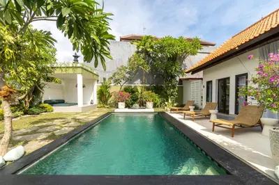 a swimming pool in the backyard of a villa at CASTELU 3BR peacefully villa near Mertanadi in Seminyak
