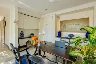 a dining room with a table and chairs at The Kanjeng Suites Petitenget in Seminyak