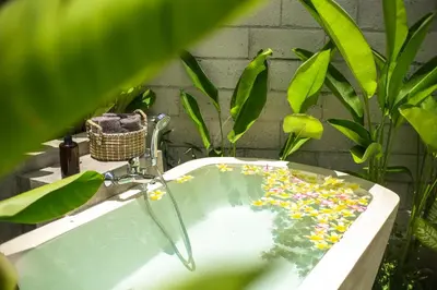 a bathroom sink with sprinkles in it at Villa Kamal Umalas in Kerobokan