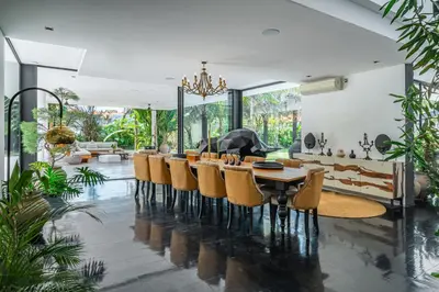 a dining room with a table and chairs at Villa Bull House Amazing 6 bedrooms contemporary villa in Seminyak in Seminyak