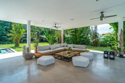 a living room with a couch and chairs and a table at Villa Bull House Amazing 6 bedrooms contemporary villa in Seminyak in Seminyak