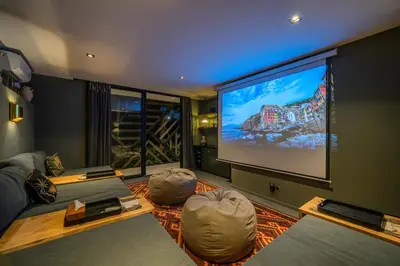 a large living room with a large screen television at Villa Bull House Amazing 6 bedrooms contemporary villa in Seminyak in Seminyak
