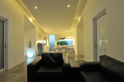 a living room with a couch and a table at Bali Yarra Villas - Seminyak in Seminyak