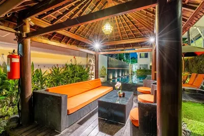 an outdoor living room with a pergola at Bali Yarra Villas - Seminyak in Seminyak