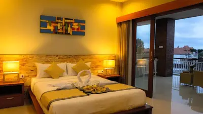 a bedroom with a bed with a bowl of bananas on it at Kubu De Uma in Seminyak