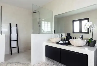 a bathroom with two sinks and a large mirror at Villa Anaya Manis in Seminyak