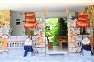 an entrance to a building with red lanterns on it at Manggar Indonesia Hotel in Kuta
