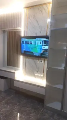 a tv sitting on a shelf in a closet at 4 BEDROOM VILLA KUTA REGENCY B10 in Kuta