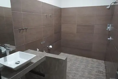 a bathroom with a sink and a shower at 4 BEDROOM VILLA KUTA REGENCY B10 in Kuta