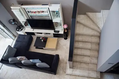 an overhead view of a living room with a flat screen tv at 4 BEDROOM VILLA KUTA REGENCY B10 in Kuta