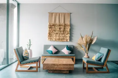 a living room with a couch and two chairs and a coffee table at Bestah Coliving in Sanur