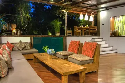 a living room with couches and a coffee table at Villa Istimewa in Seminyak