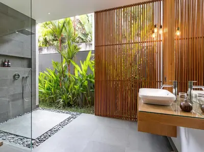 a bathroom with a shower and a sink and a shower at Villa Castil di Udara by Villa Finder in Kerobokan