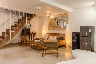 a living room with a couch and a table at Mara Villa, Garden & Pool, 2 min to Seminyak Beach in Seminyak