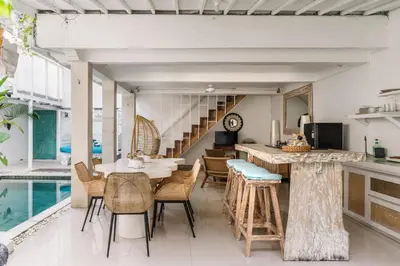 a kitchen and dining room with a table and chairs at Mara Villa, Garden & Pool, 2 min to Seminyak Beach in Seminyak