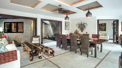 a living room with a dining room table and chairs at Villa Avalon by Elite Havens in Canggu