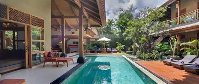 a swimming pool in the middle of a house at Villa Kinaree Estate in Seminyak