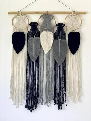 a group of tassels hanging on a wall at Villa Biru - 500m Batubelig beach in Canggu