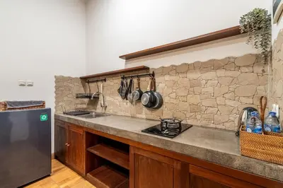 a kitchen with a sink and a counter top at Kamaratih Villas by Maheswara in Legian