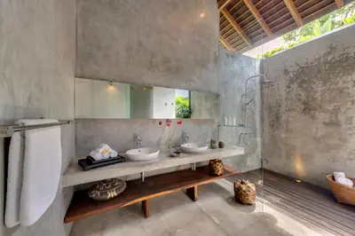 a bathroom with two sinks and a mirror at Villa Kavya - 8-minute walk from Berawa Beach in Canggu