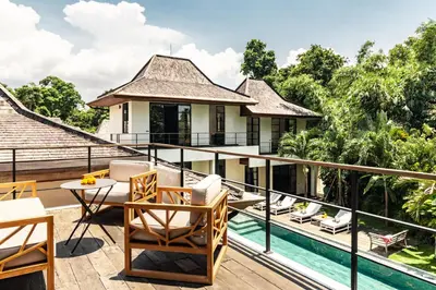 a balcony with a view of a villa at PROMO Large Astonishing 5 BR Luxury Private Villa in Canggu
