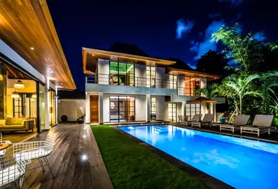 a villa with a swimming pool at night at PROMO Large Astonishing 5 BR Luxury Private Villa in Canggu