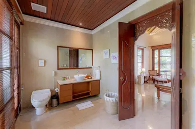 a bathroom with a toilet and a sink at Villa Dorado - Steps from Jimbaran Beach in Jimbaran