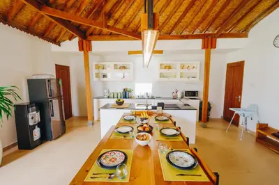 a kitchen with a table with plates of food on it at Villa Orked 3 with family room Seminyak in Seminyak