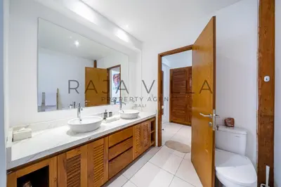 a bathroom with a sink and a toilet at Villa Kainara Seminyak by RPM in Seminyak