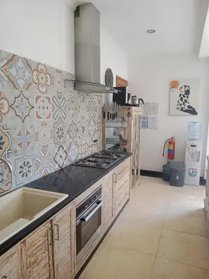 a kitchen with a sink and a stove top oven at Villa Filo's Paradise Pool n Spa. Seminyak in Seminyak